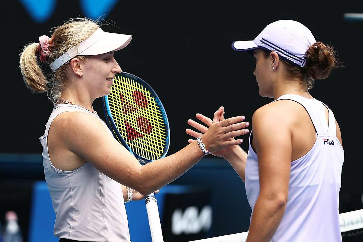 MELBOURNE, AUSTRALIA - FEBRUARY 11: Daria Gavrilova of Australia and Ashleigh Barty of Australia embrace at the net following their Women's Singles second round match during day four of the 2021 Australian Open at Melbourne Park on February 11, 2021 in Melbourne, Australia. (Photo by Mark Metcalfe/Getty Images)