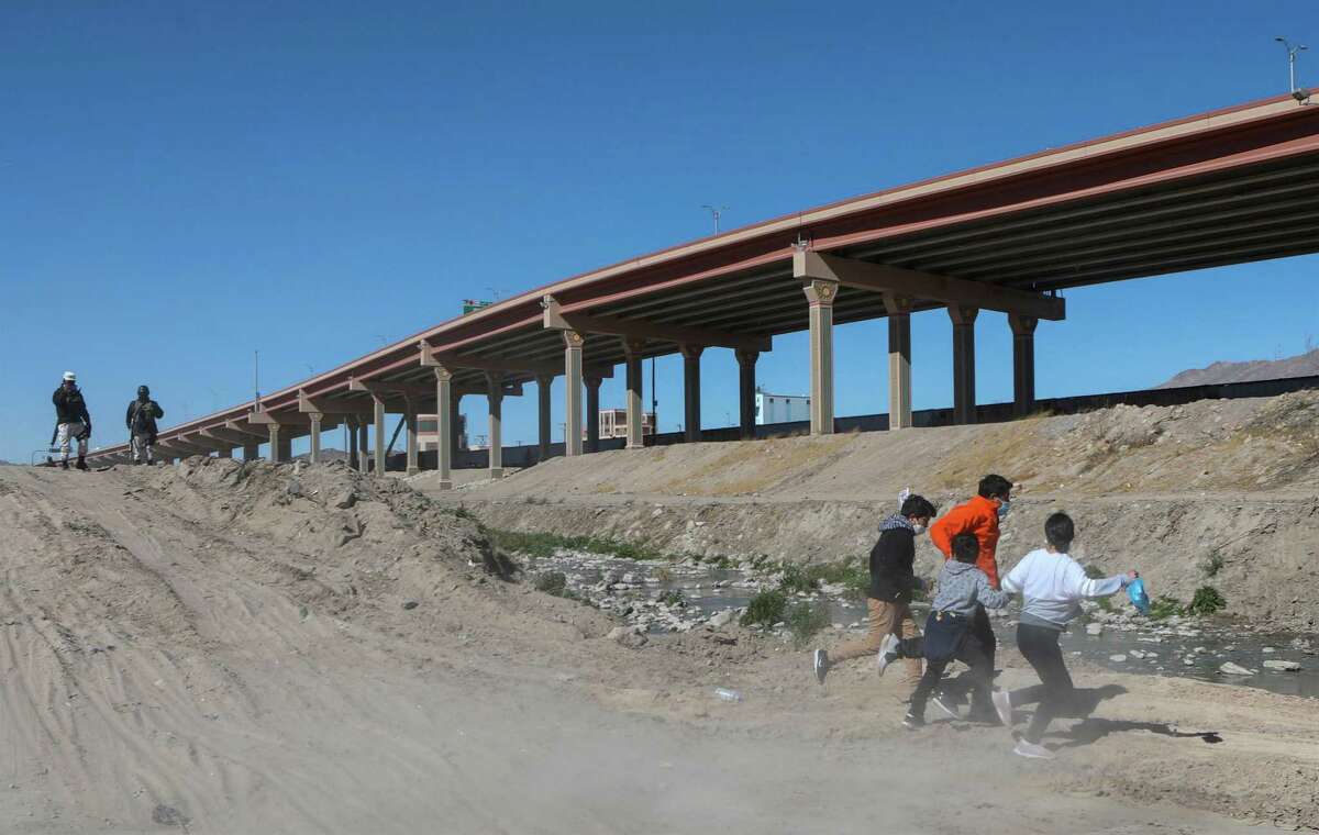 Migrants cross the Rio Bravo to get to El Paso, state of Texas, US, From Ciudad Juarez, Chihuahua state, Mexico on February 5, 2021.