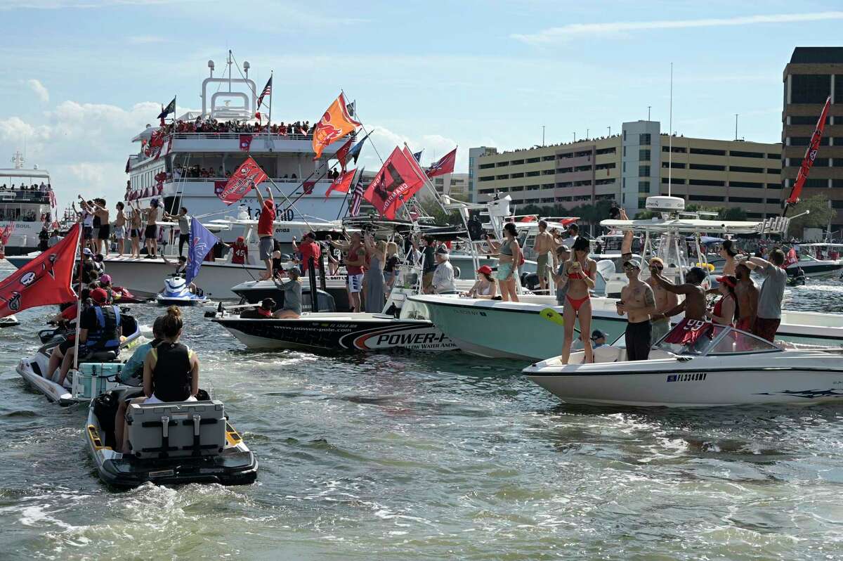 Tom Brady Tosses Super Bowl Trophy From Boat to Boat During Victory Flotilla