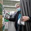 John Armour shops for faucet covers and pipe insulation at M&D Supply Ace Hardware, Wednesday, Feb. 10, 2021, in Cypress, Texas. Potential freezing temperatures are being forecast for this weekend into midweek for Southeast Texas. (Melissa Phillip/Houston Chronicle via AP)