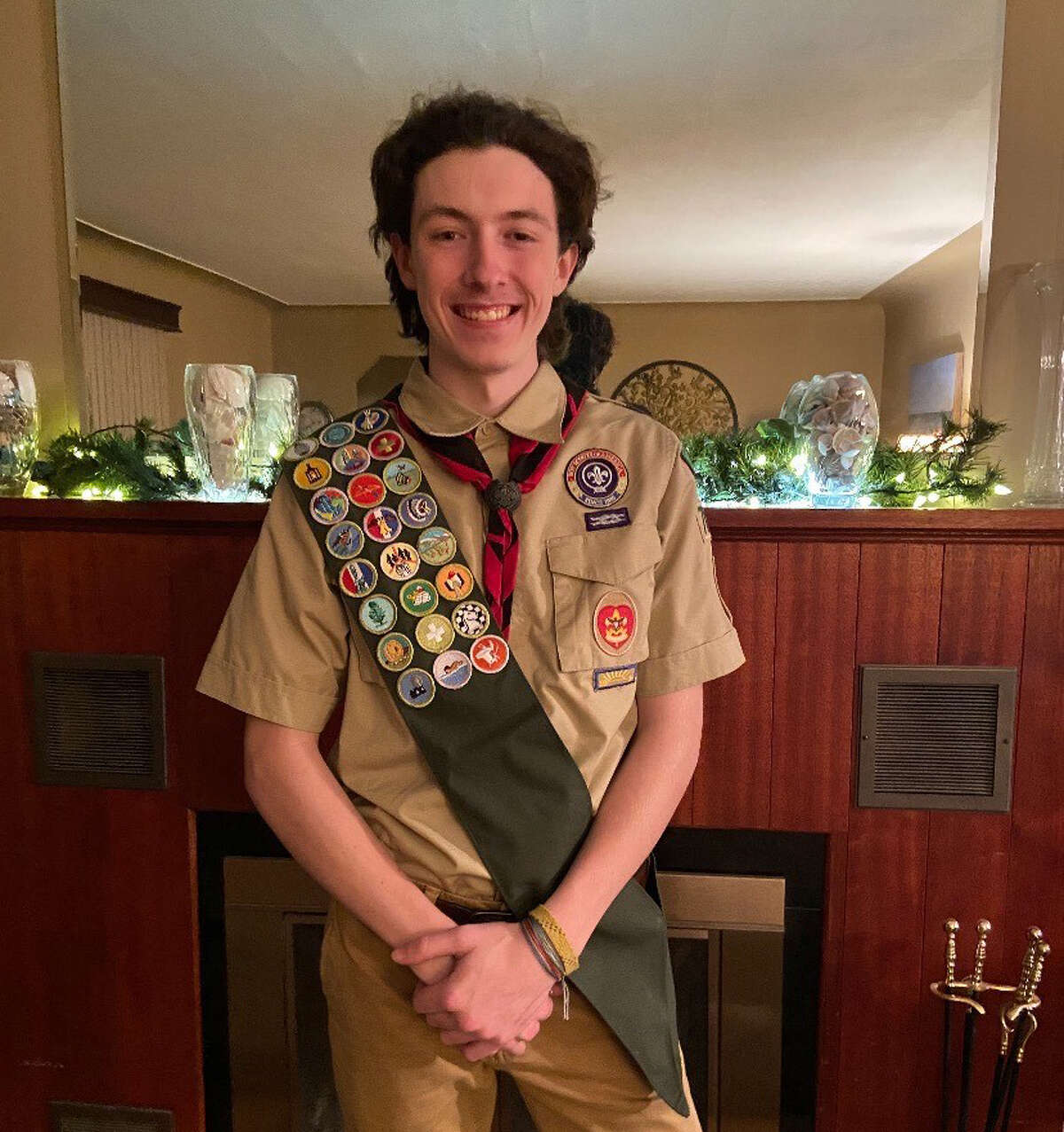 Midland High's Tanner Squires poses at his home on Jan. 28, 2021 after completing his Eagle Scout Board of Review evaluation with the Water and Woods Field Service Council of the Boy Scouts of America via a Zoom meeting.