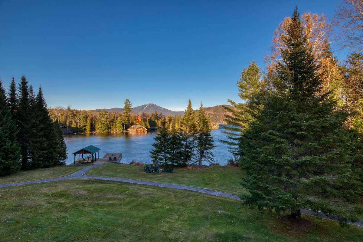Built between 1998 and 2001 on the shore of Lake Placid, 62 Peninsula Point was designed to look like an Adirondack Great Camp. It has 10,000 square feet, eight bedrooms, an elevator, 2,500 feet of shoreline and sits on 23 acres.