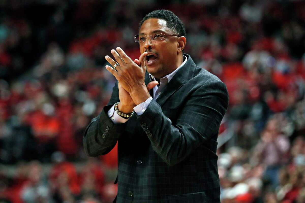 FILE - In this Saturday, Dec. 21, 2019, file photo, Texas-Rio Grande Valley coach Lew Hill claps after a play during the first half of an NCAA college basketball game against Texas Tech, in Lubbock, Texas. Texas Rio Grande Valley says Hill died Sunday, Feb. 7, 2021, a day after coaching a basketball game against Texas Southern. He was 55. (AP Photo/Brad Tollefson, File)