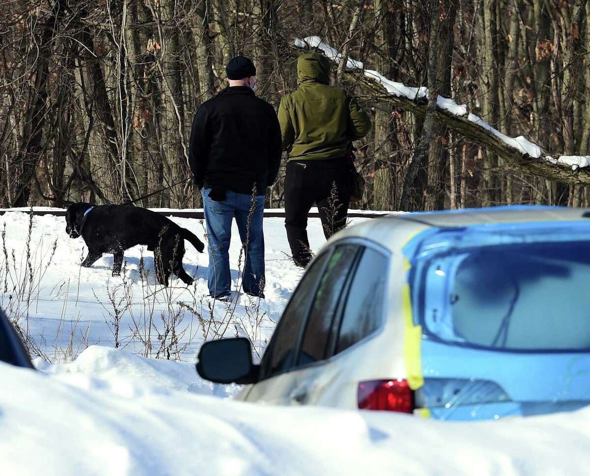 New Haven Police investigate an area behind Arby's on Washington Avenue in North Haven near the Best Western Plus with K-9s and metal detectors on February 11, 2021.