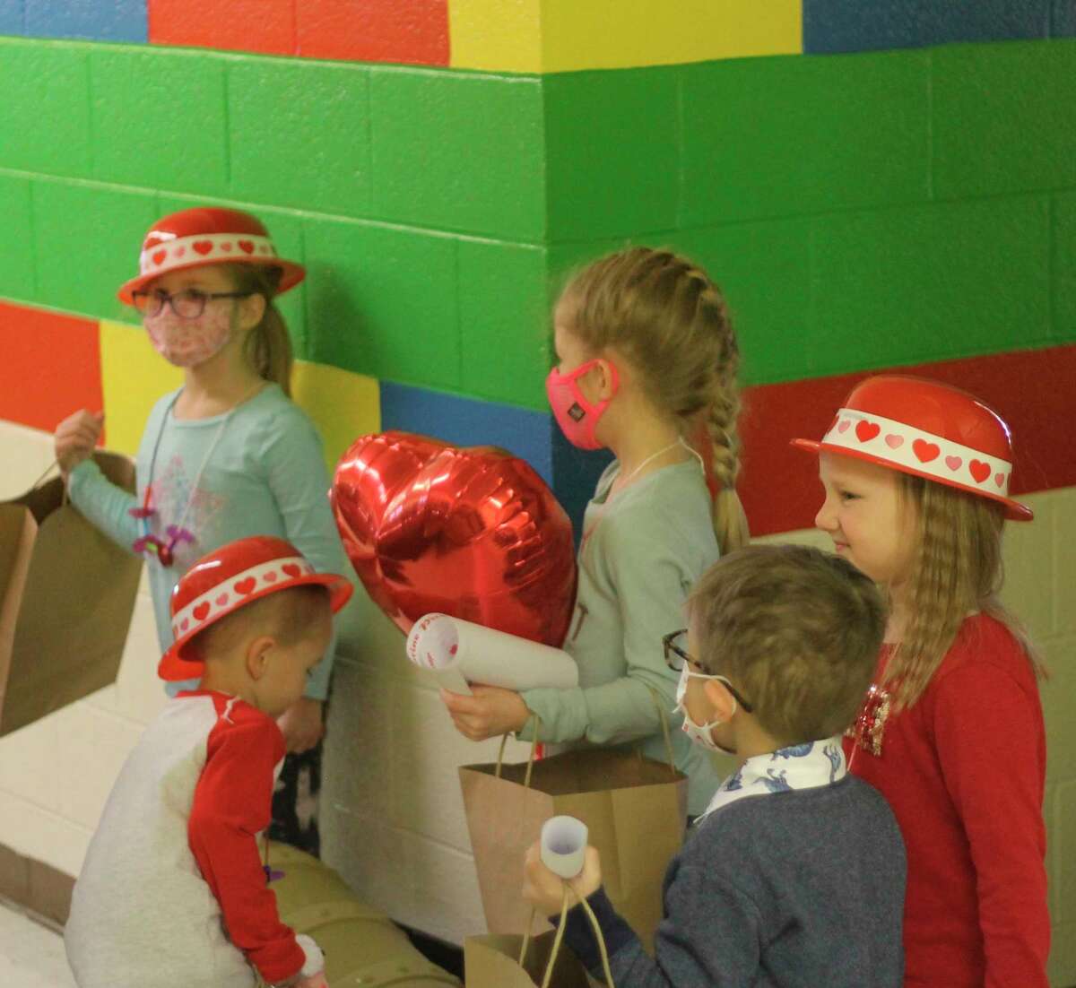 Kindergarten and preschool students at Trinity Lutheran School find the treasure chest of the Valentine Pirate on Thursday. (Kyle Kotecki/News Advocate)