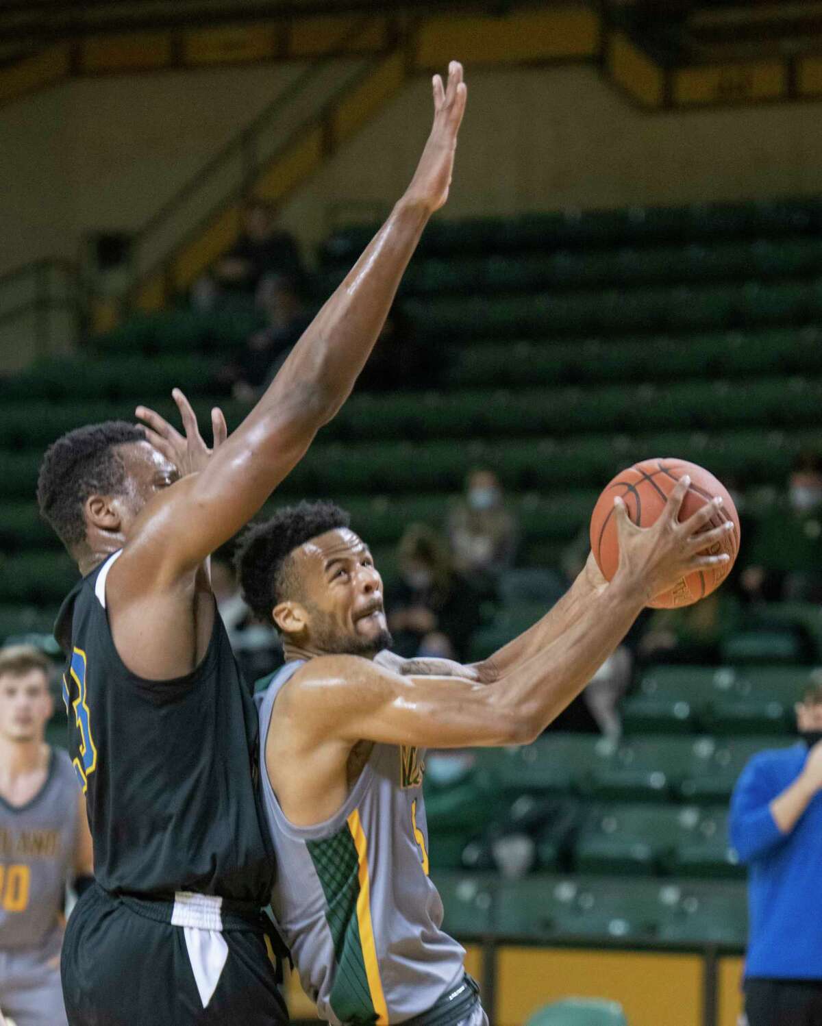 Midland College's Steven Richardson tries to slip past Frank Phillips' Adeola Seun for a basket 02/11/2021 at the Chaparral Center. Tim Fischer/Reporter-Telegram