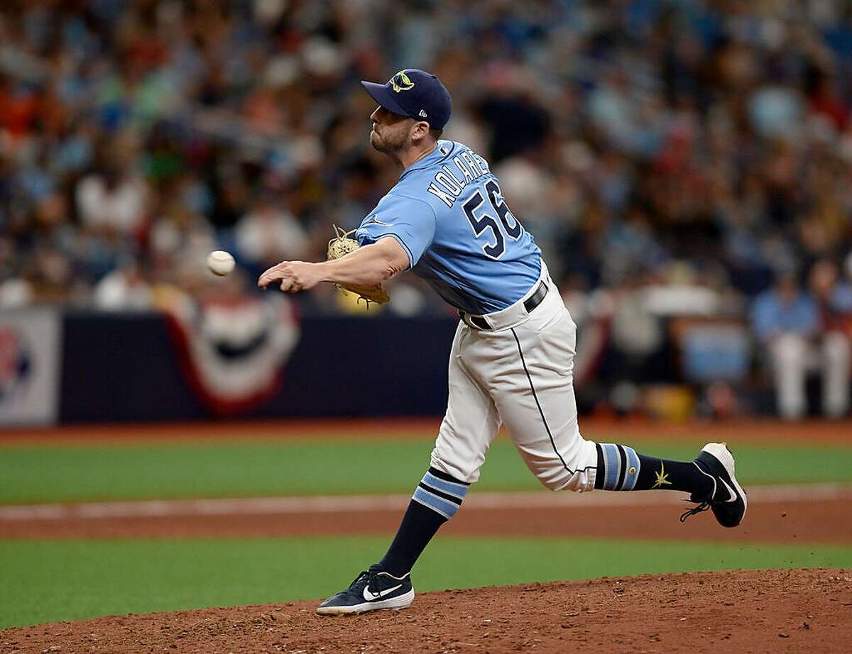 Tampa Bay Rays relief pitcher Adam Kolarek (56) throws during the eighth inning of a baseball game against the Houston Astros Sunday, March 31, 2019, in St. Petersburg, Fla. (AP Photo/Jason Behnken)
