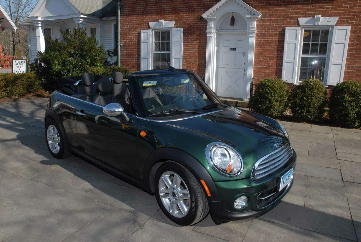 A 2013 Mini Cooper Convertible is the raffle prize.