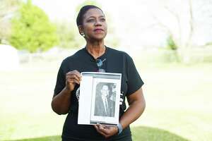 Veronica Harris, holds a photo of her grandfather Willie Melton, a wealthy farmer who fought for the right to vote in the free primaries in Fort Bend County in Kendleton on Thursday, Feb. 4, 2021. The case went all the way to the U.S. Supreme Court.