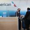 CHICAGO, ILLINOIS - FEBRUARY 05: A passenger arrives for an American Airlines flight at O'Hare International Airport on February 05, 2021 in Chicago, Illinois. American Airlines and United Airlines, two of the nation's largest carriers, are anticipating having to furlough thousands of employees as both companies continue to see a pandemic-related slow-down in air travel. (Photo by Scott Olson/Getty Images)