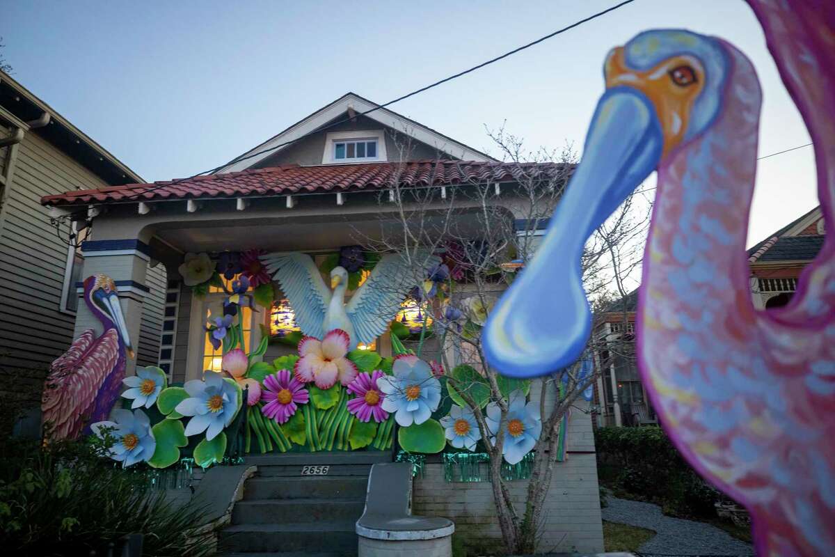 With parades canceled, New Orleanians are decorating their homes and businesses to resemble Mardi Gras floats.