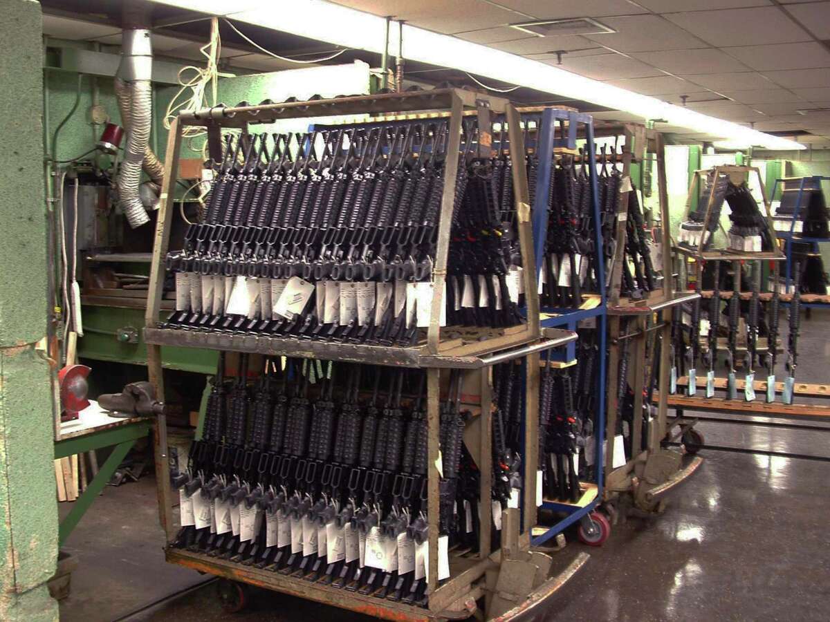 FILE - In this March 27, 2008, file photo, M4 Colt rifles are produced at the Colt Defense Plant in Hartford, Conn. The 179-year-old gun maker filed for chapter 11 bankruptcy on Sunday, June 14, 2015, estimating it owes up to $500 million. Analysts cite several reasons behind Colt's bankruptcy filing, including struggles to recover from the loss of military business and failure to capitalize on consumer interest in guns.