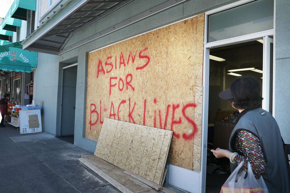 Boards on businesses on Webster Street in Oakland’s Chinatown last year convey community support for Black Lives Matter.