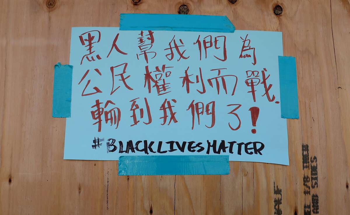 A sign seen at Yung Kee in Oakland’s Chinatown last year conveys the community’s support for Black Lives Matter.