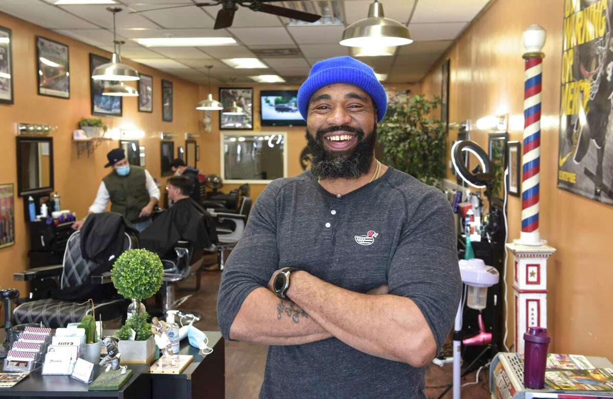 Everton Stewart in his Barbershop on Friday afternoon. Stewart has had an apprentice in the shop. An effort led by U.S. Rep. Jahana Hayes that would update and expand the national apprenticeship program and bring an annual $2 million to Connecticut to promote the “earn while you learn” model of vocational development. February 12, 2021.