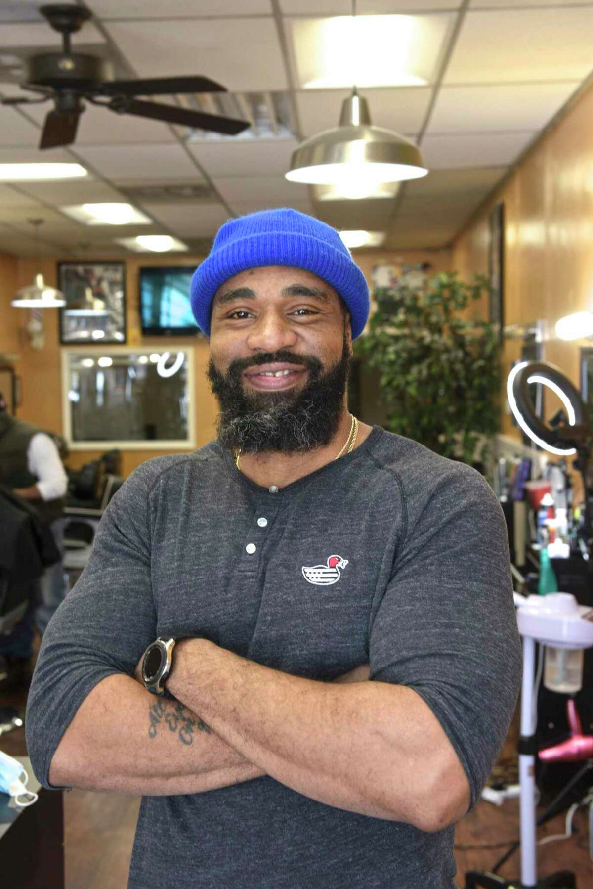 Everton Stewart in his Barbershop on Friday afternoon. Stewart has had an apprentice in the shop. An effort led by U.S. Rep. Jahana Hayes that would update and expand the national apprenticeship program and bring an annual $2 million to Connecticut to promote the “earn while you learn” model of vocational development. February 12, 2021.