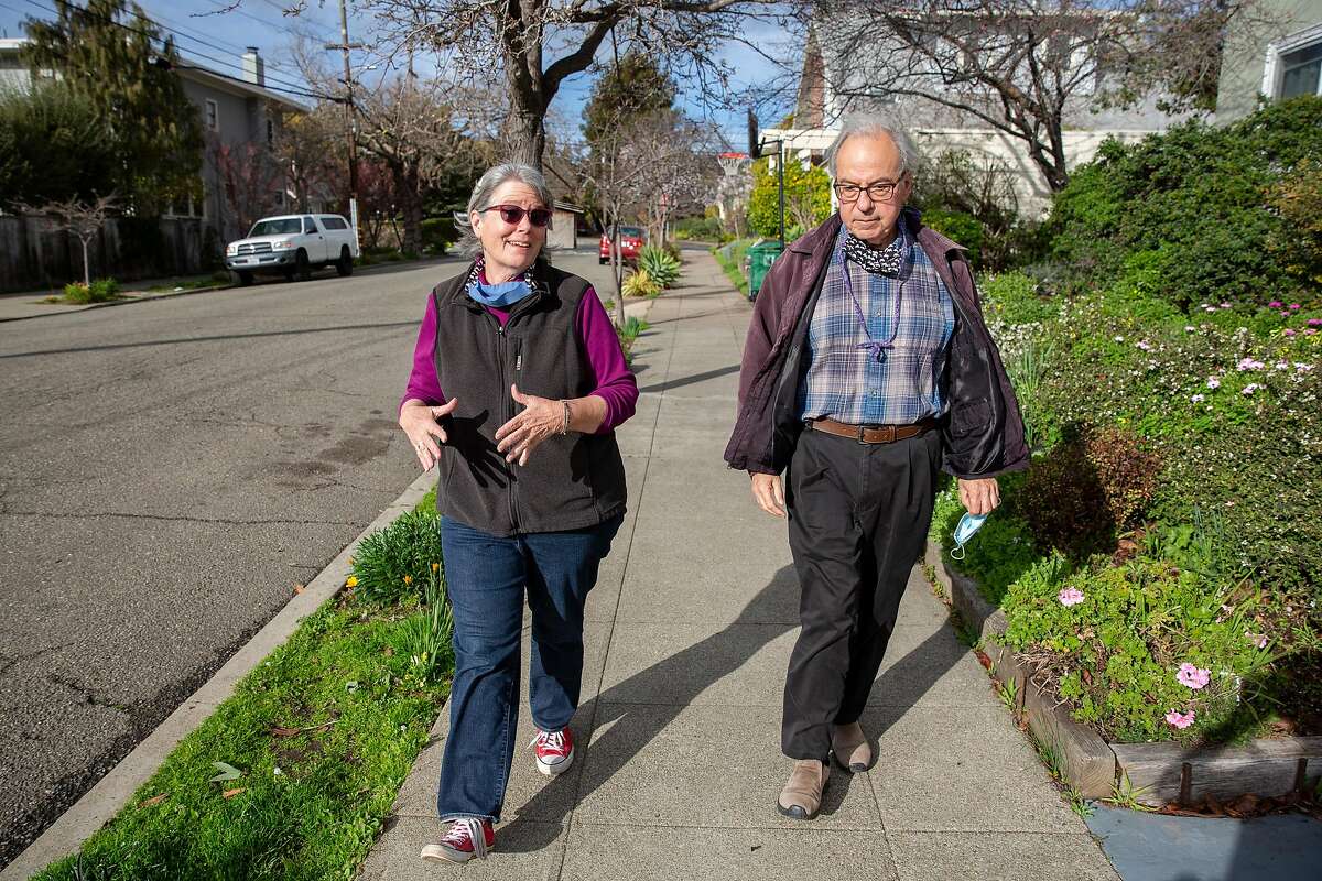 Kaiser Permanente members Janine Bajus and John Culver go for their daily walk near their Berkeley home.