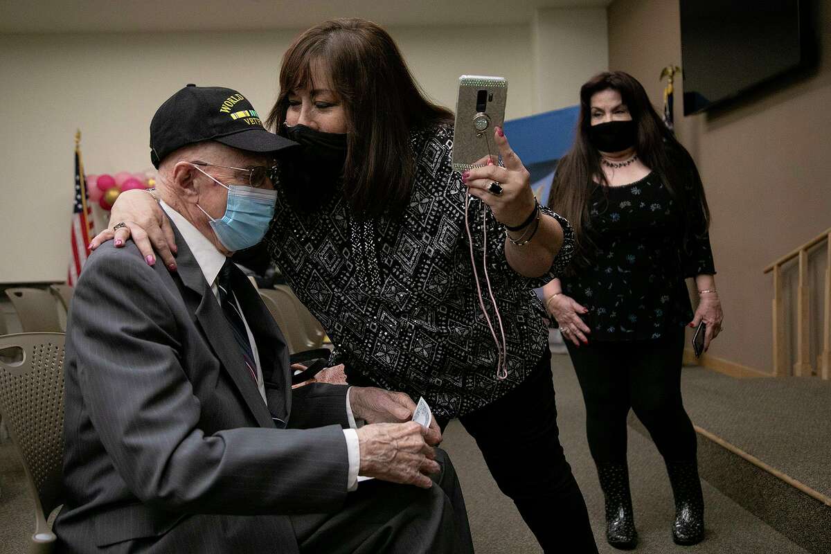 Linda Arce gives her neighbor, Heinz Bachman, 99, a hug after he was sworn in as a U.S. citizen at the U.S. Citizenship and Immigration Services field office in San Antonio on Thursday. At right is her sister, Diana Flores, also Bachman's neighbor since 1961. Bachman became a citizen as a child when his dad was naturalized in 1934, but needed the proof to renew his Texas driver’s license.