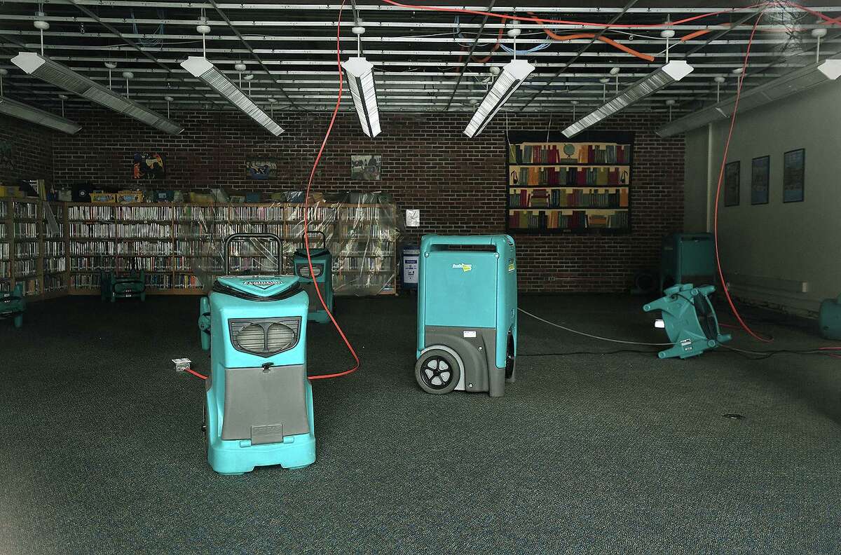 Dehumidifiers and fans dry out North Mianus Elementary School after a pipe burst and flooded the school in Greenwich, Conn. on Sunday, February 14, 2021.