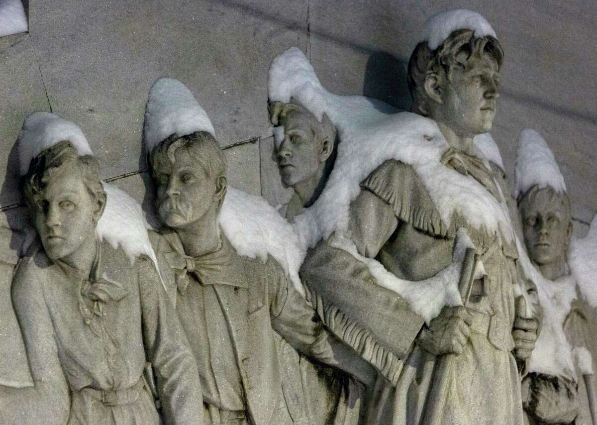 Figures on the Alamo Cenotaph are covered in snow early Monday morning, Feb. 15, 2021. The National Weather Service reported Tuesday morning that San Antonio and surrounding areas saw 3-5 inches of snow and some pockets of the forecast area saw 6-7 inches of snow. The Electric Reliability Council of Texas (ERCOT) has also declared the highest level of energy emergency and is requiring rolling blackouts throughout Texas. The National Weather Service reports the areas temperatures are the coldest since 1989.