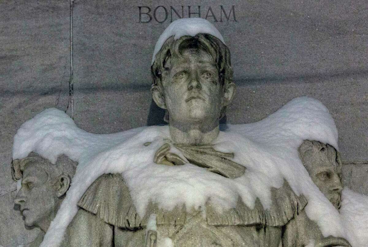 The figure of James Bonham on the Alamo Cenotaph is covered in snow early Monday morning, Feb. 15, 2021. The National Weather Service reported Tuesday morning that San Antonio and surrounding areas saw 3-5 inches of snow and some pockets of the forecast area saw 6-7 inches of snow. The Electric Reliability Council of Texas (ERCOT) has also declared the highest level of energy emergency and is requiring rolling blackouts throughout Texas. The National Weather Service reports the areas temperatures are the coldest since 1989.