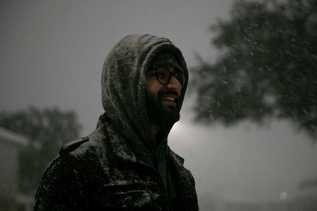 Umair Iqbal enjoys the snow, the most he has ever seen, early Monday morning, Feb. 15, 2021, in San Antonio.