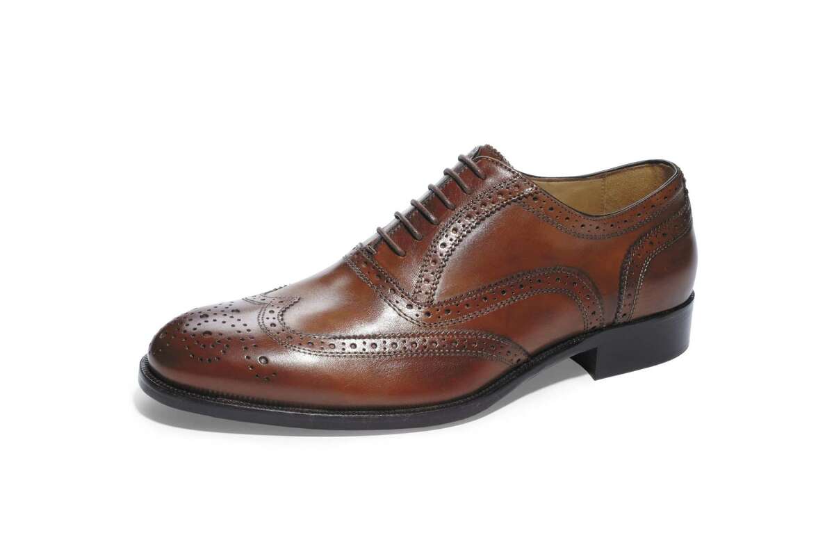 Traditional men's wingtip in dark brown from Saks house label.