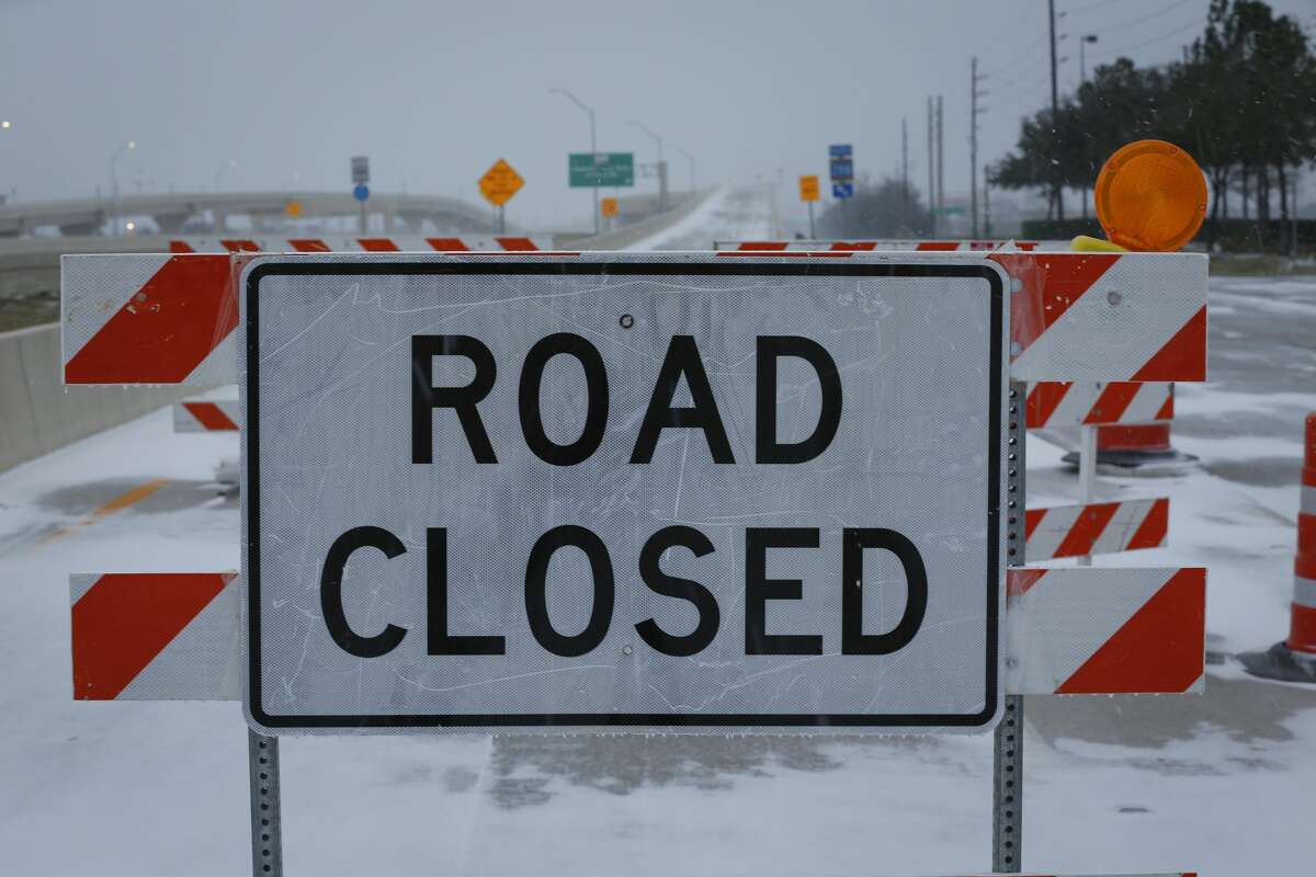 The entrance ramp to SH 288 is closed due to slick conditions Monday, Feb. 15, 2021, in Pearland.