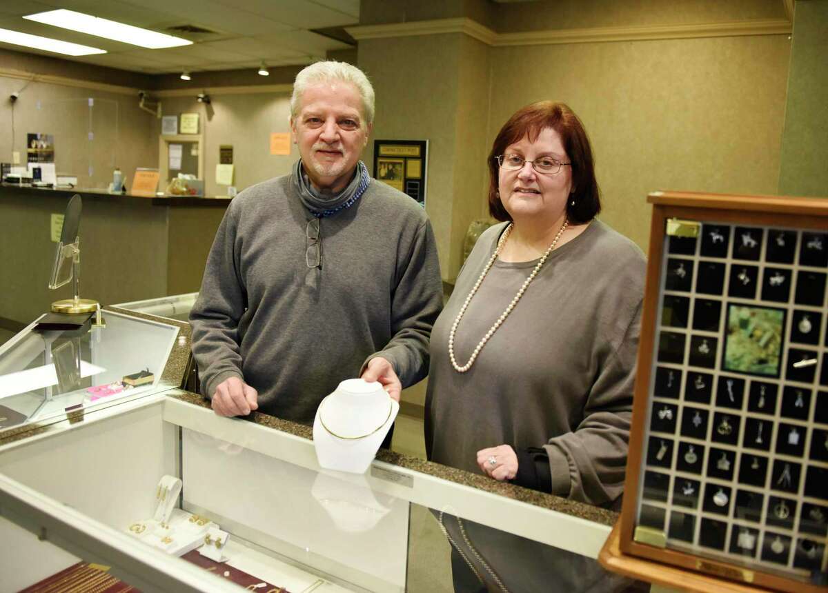 Owners Larry Weinroth and Ruth Weinroth Adatto pose together at Bedford Jewelers at 838 High Ridge Road in Stamford, Conn., on Tuesday, Jan. 26, 2021. After 71 years in business, Bedford Jewlers will close down as the owners plan to retire. The store on High Ridge Road is holding a closing sale before closing its doors on Feb. 20.