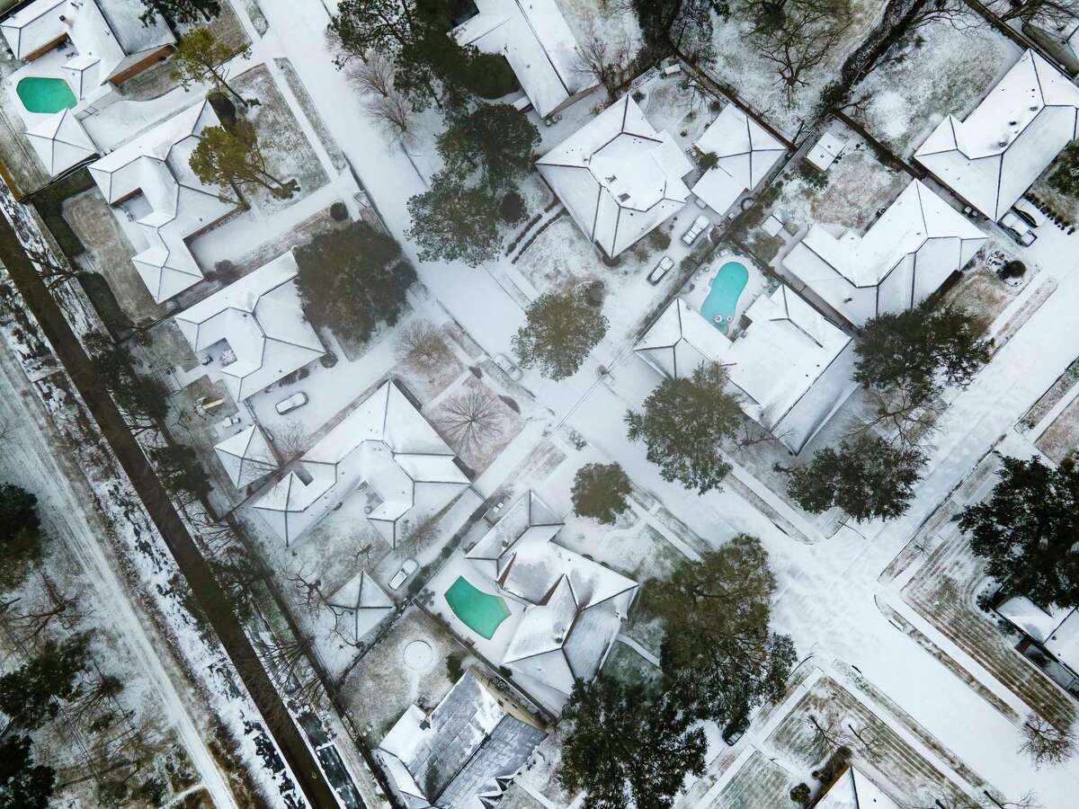Homes in the Westbury neighborhood are covered in snow along with the rest of Houston on Monday, February 15, 2021, in Houston.