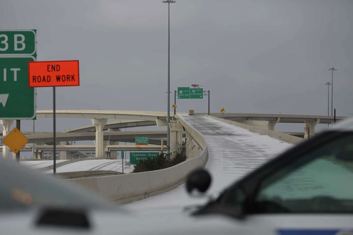 Harris County Sheriff's deputies blocking the ramps from Interstate 10 westbound toward Texas 99 due to the icy road conditions Monday, Feb. 15, 2021, in Houston.