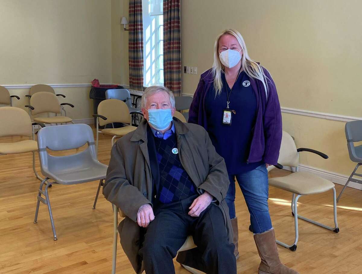 Director of Health Jenn Eielson stood behind First Selectman Kevin Moynihan shortly after he got vaccinated at the Lapham Center in Waveny Park, on Wednesday, Feb. 10.