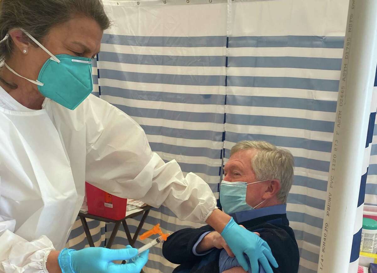 Human Service Director Bethany Zaros gave First Selectman Kevin Moynihan his  a vaccine at Lapham Center in Waveny Park in New Canaan, on Wednesday, Feb. 10.