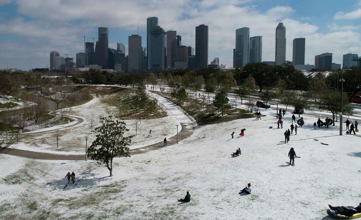 Here's something you don't see every day: People snow-sledding at Buffalo Bayou Park in Houston, Monday, Feb. 15, 2021.