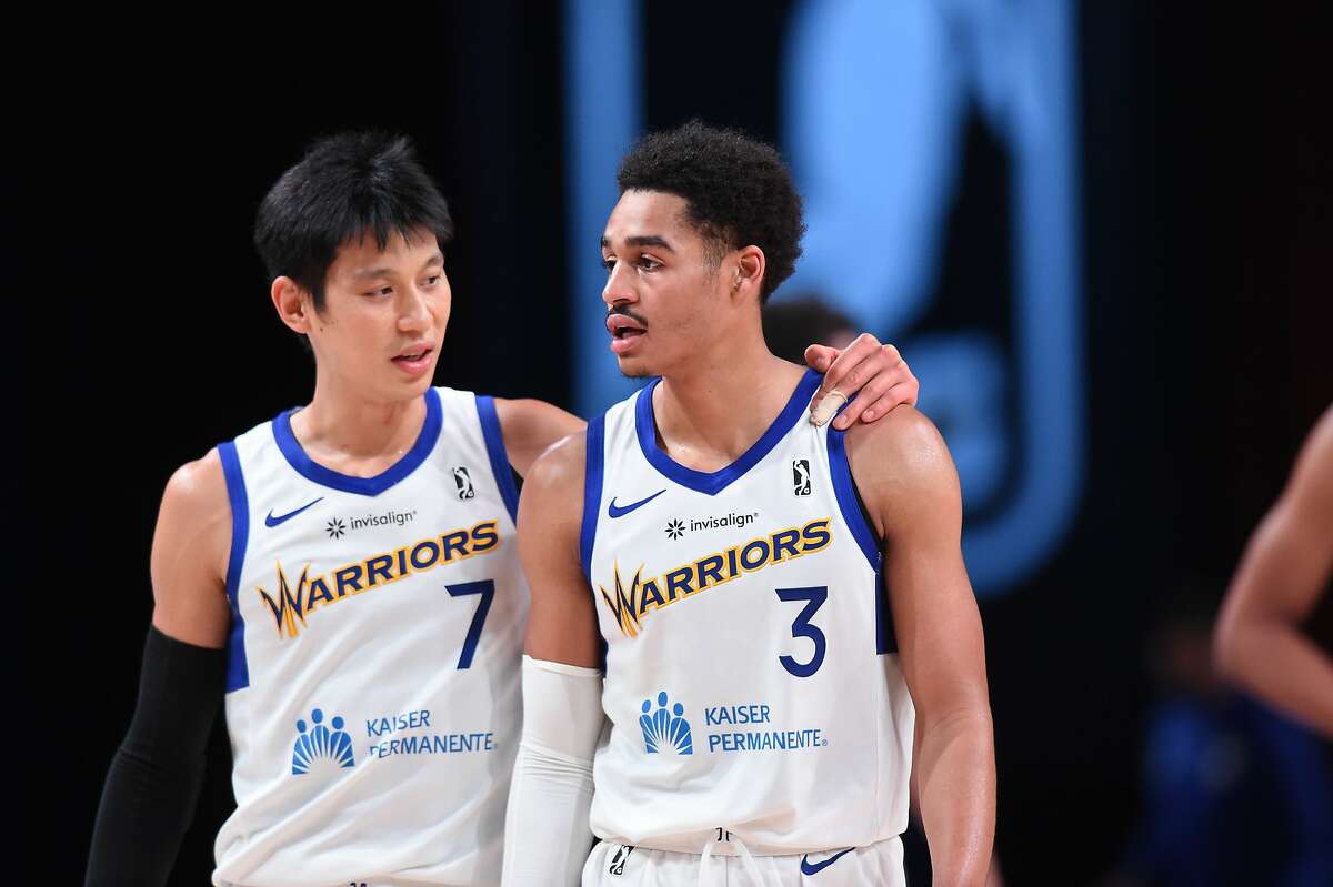 Jeremy Lin talks to fellow Santa Cruz Warriors guard Jordan Poole during a recent game at the G League bubble in Orlando.