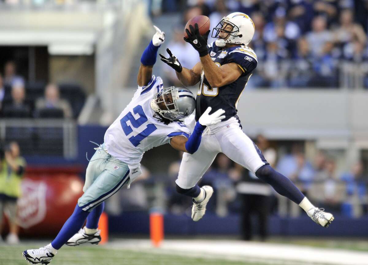 San Diego Chargers wide receiver Vincent Jackson, right, hauls in a pass for a reception as Dallas Cowboys cornerback Mike Jenkins (21) defends in the first half of an NFL football game, Sunday, Dec. 13, 2009 in Arlington, Texas. (AP Photo/Michael Thomas)
