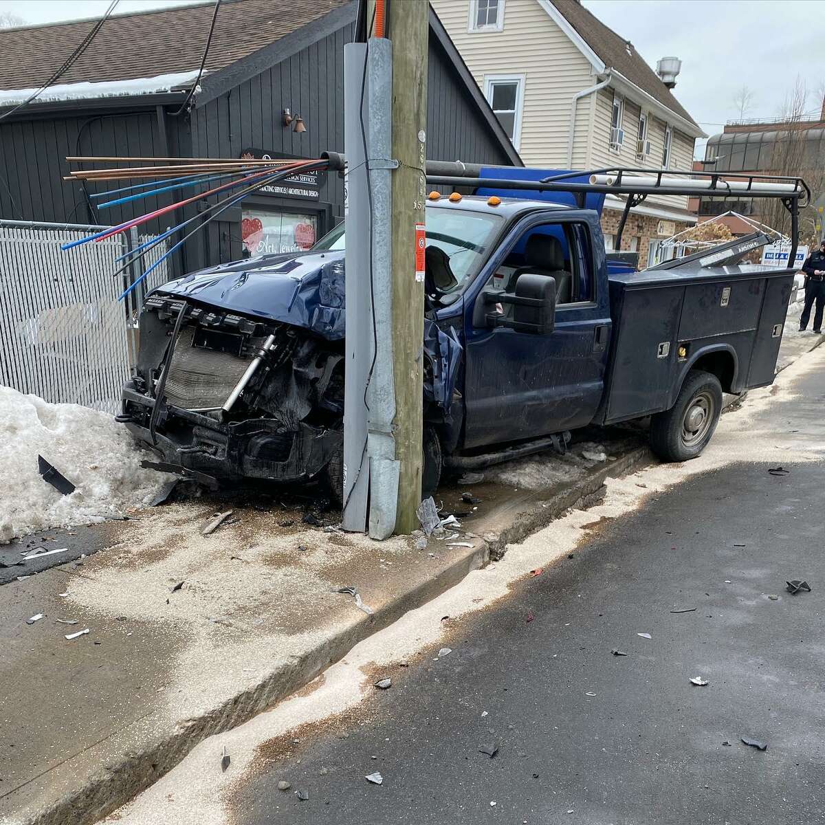 Westport police investigate car crashing into utility pole