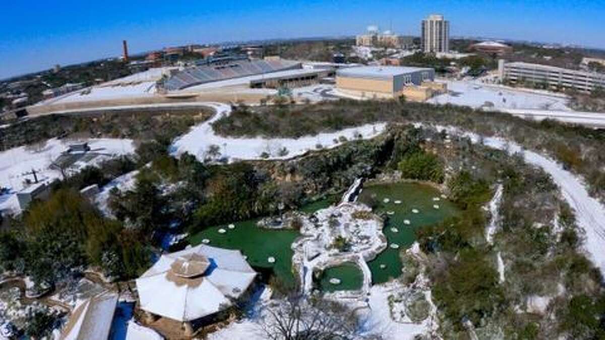 Parts of San Antonio covered in snow as seen from aerial footage.
