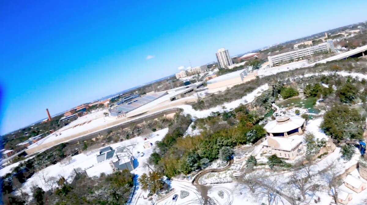 Parts of San Antonio covered in snow as seen from aerial footage.