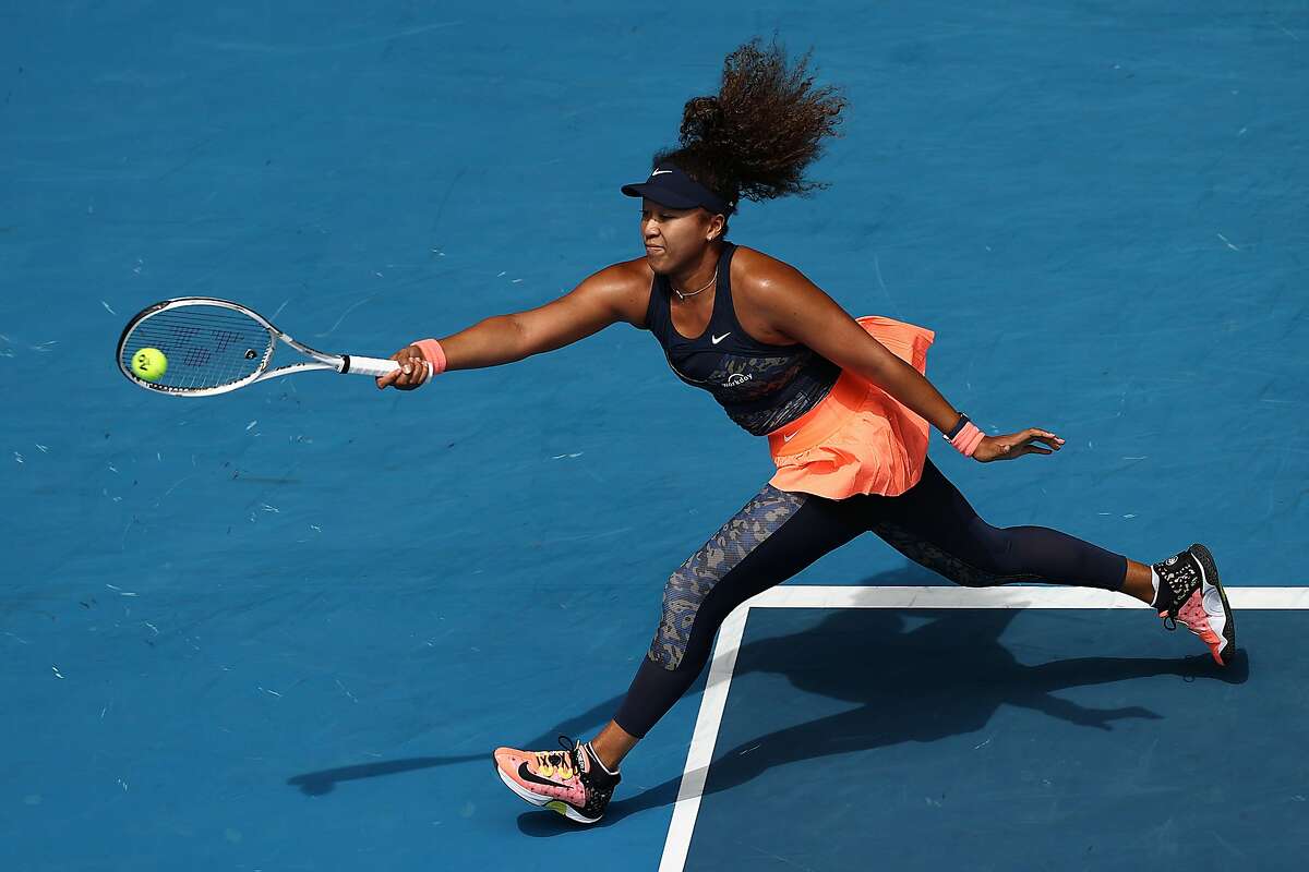 Naomi Osaka of Japan plays a forehand in her singles quarterfinals match against Hsieh Su-Wei of Chinese Taipei during Day 9 of the 2021 Australian Open at Melbourne Park on Tuesday. Osaka won 6-2, 6-2.