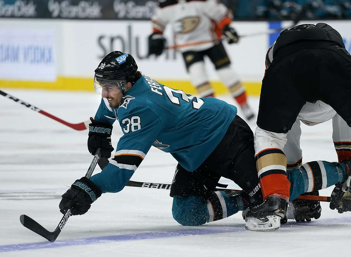 Sharks defenseman Mario Ferraro (38) reacts as he is tripped by Anaheim Ducks center Rickard Rakell during the second period of a Sharks win in San Jose.