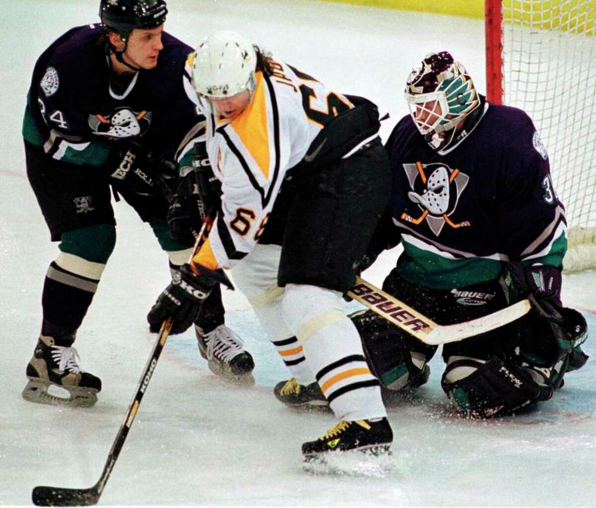 Depending on the age of an individual, the then-Anaheim Mighty Ducks' uniforms from 1993-2005 are either adored or maligned. (AP photo/Gene J. Puskar)