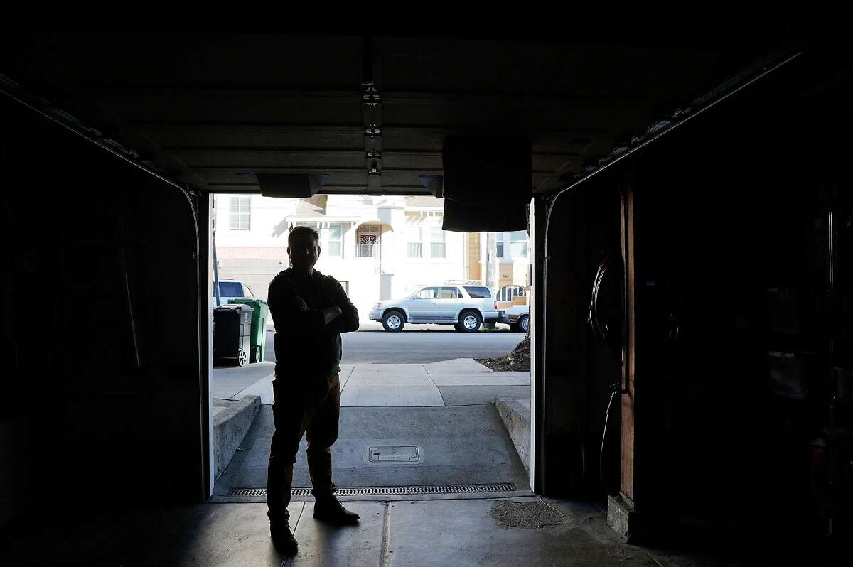 Mark Dietrich stands in his open garage door at his home in San Francisco, Calif., on Tuesday, December 22, 2020. Deitrich is a community member in the Richmond District who has taken a leadership role in helping neighbors fortify their garages amid a major spike in hot-prowl break-ins this year.