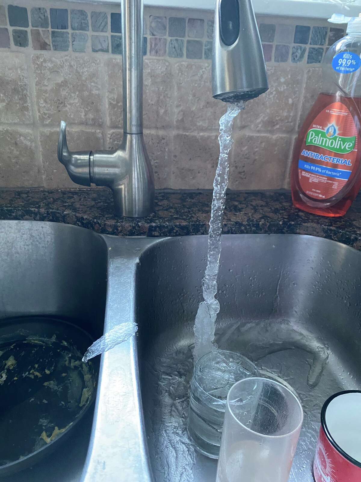 Heights-area resident Brooke Schuler shared this photo of her frozen water faucet on Tuesday morning, after she had lost power to her home and left her faucet dripping.