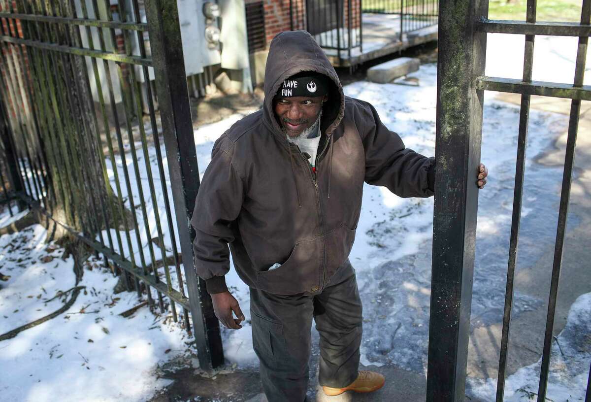 Charles Moore visits his sister Tuesday, Feb. 16, 2021, at Cuney Homes in Houston.