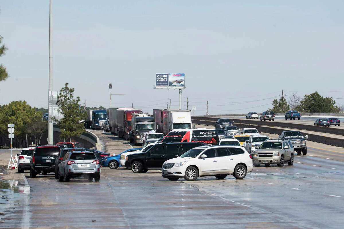 Vehicles try to exit I-45 north near Beltway 8 after southbound lanes were closed due to icy conditions Tuesday, Feb. 16, 2021 in Houston. Temperatures stayed below freezing Tuesday and roads remained icy forcing detours on a number of roads throughout the city.