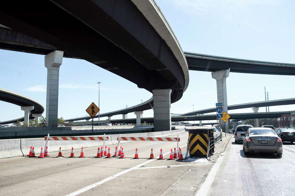 Barriers block the entrance ramp to I-45 north under Beltway 8 after southbound lanes were closed due to icy conditions Tuesday, Feb. 16, 2021 in Houston. Temperatures stayed below freezing Tuesday and roads remained icy forcing detours on a number of roads throughout the city.