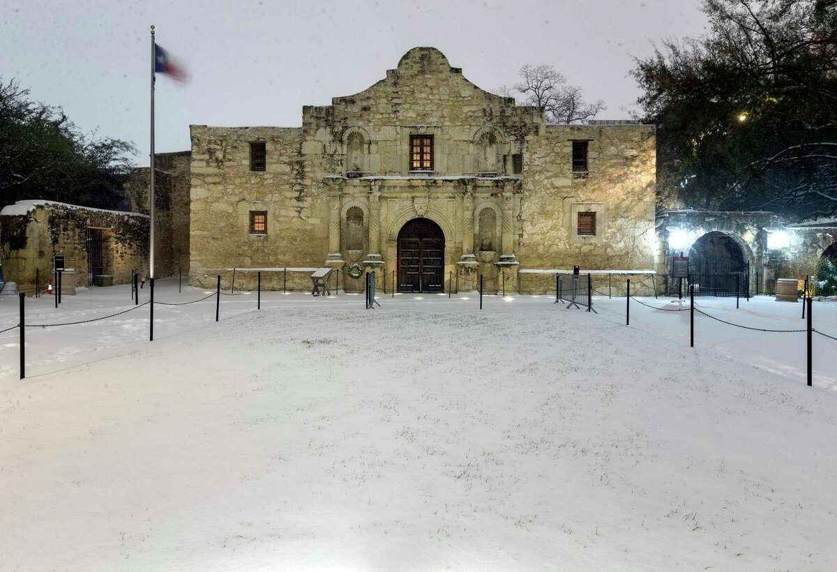 Snow blankets the Alamo early Monday, on what turned out to be a hellish day for many Texans who went without power.