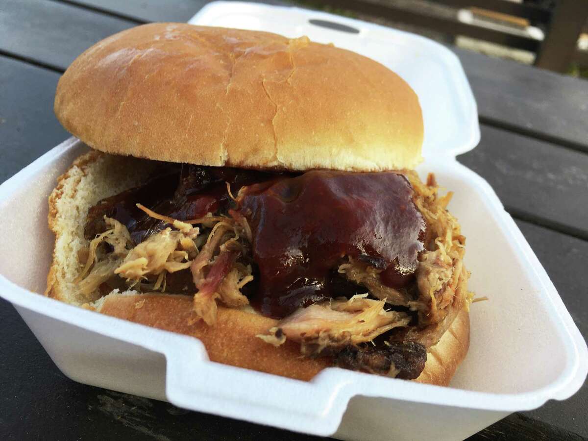 The Purple Pig is the pulled pork sandwich served at The Purple Pig BBQ.