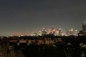 As residents froze in darkness, why was Houston's skyline lit up?
